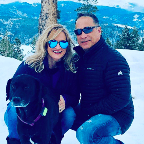 dog with pet parent in snow