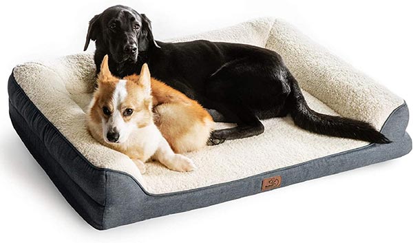 Photo of 2 dogs laying in a Bedsure Orthopedic Memory Foam Dog Bed